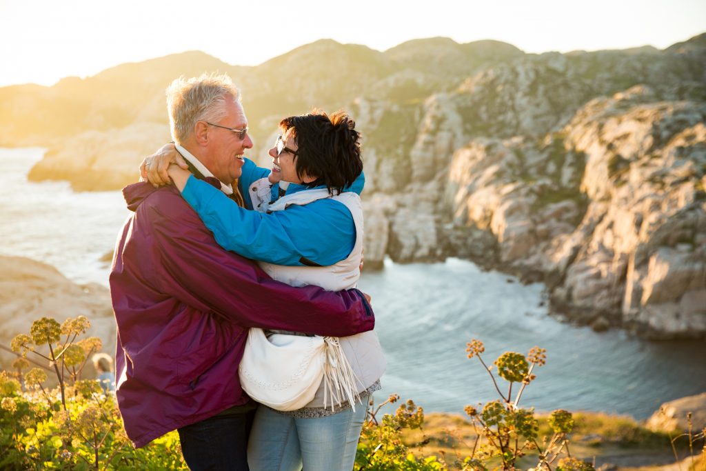 An elderly white couple on a clifftop